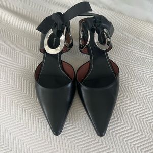 Proenza Schouler Black Leather Mules with Grommet Detailing. Lightly worn.